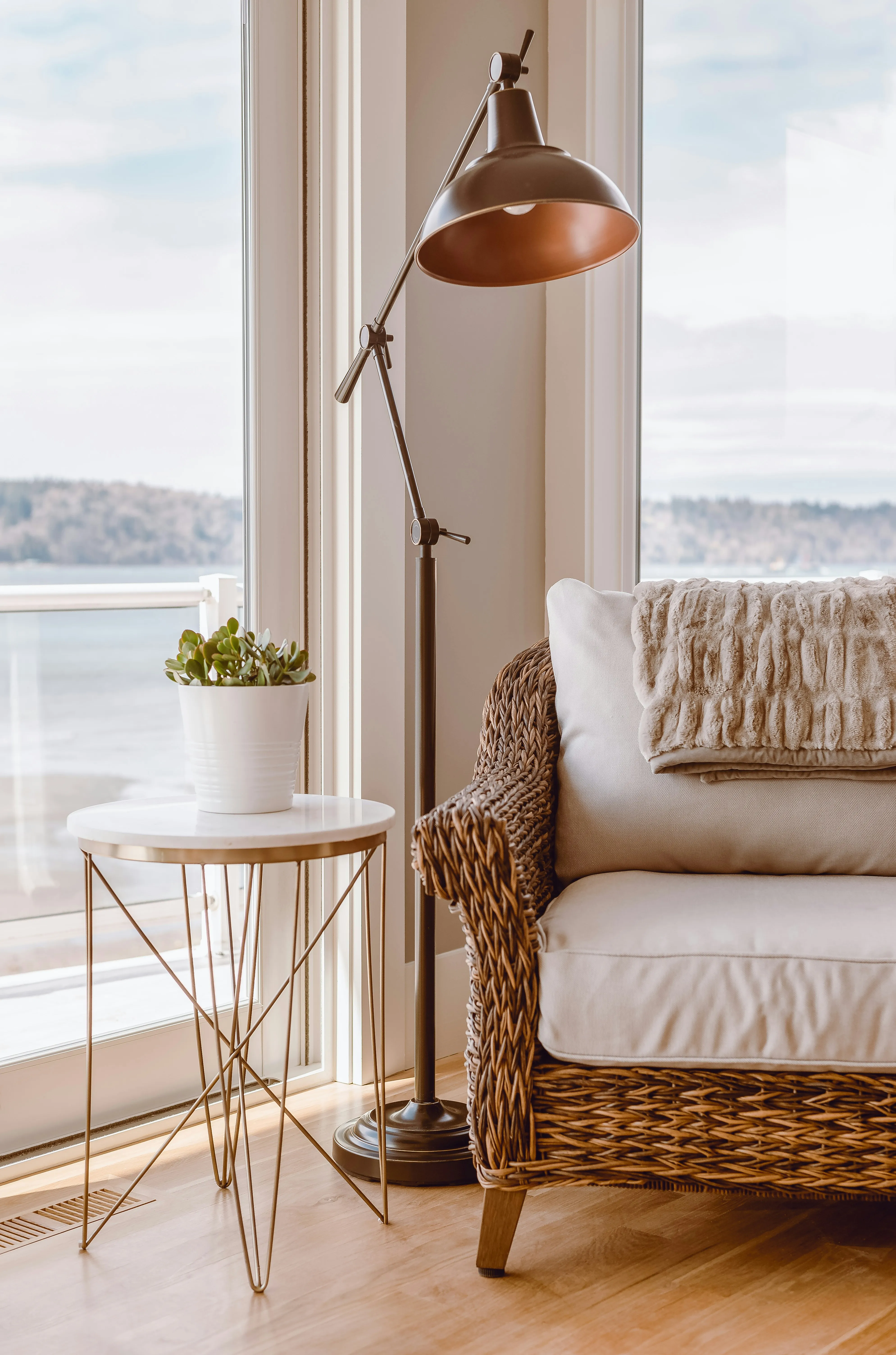 A calm, sunlit reading nook with a view of the water